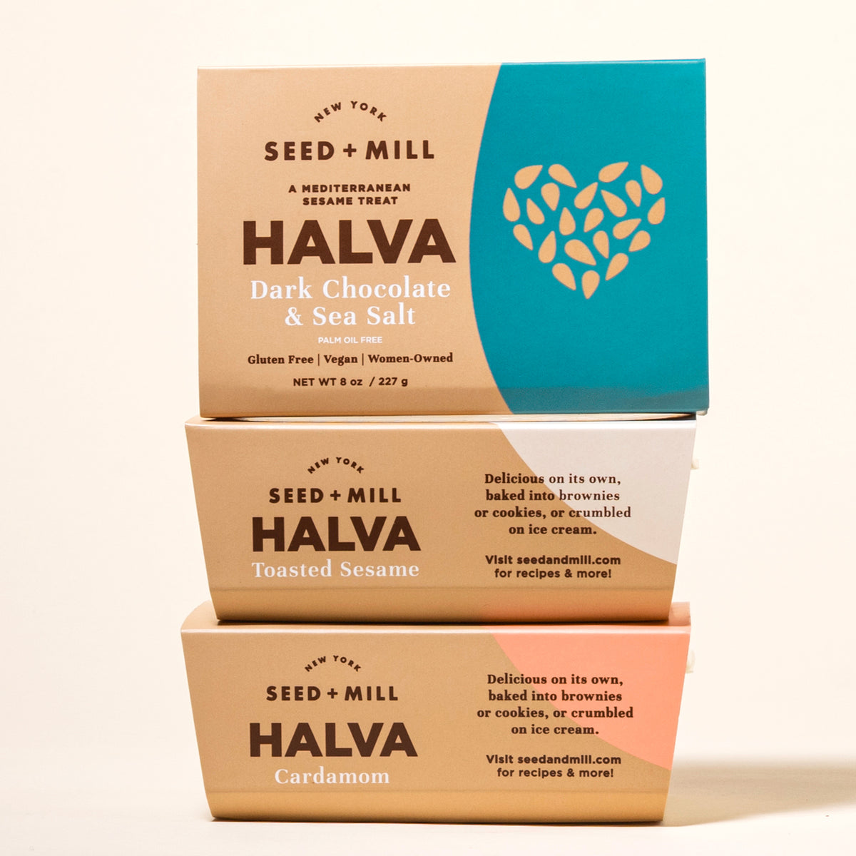 Three boxes of Seed + Mill Halva on a beige background