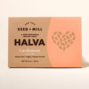 Box of Seed + Mill Cardamom Halva on a beige background
