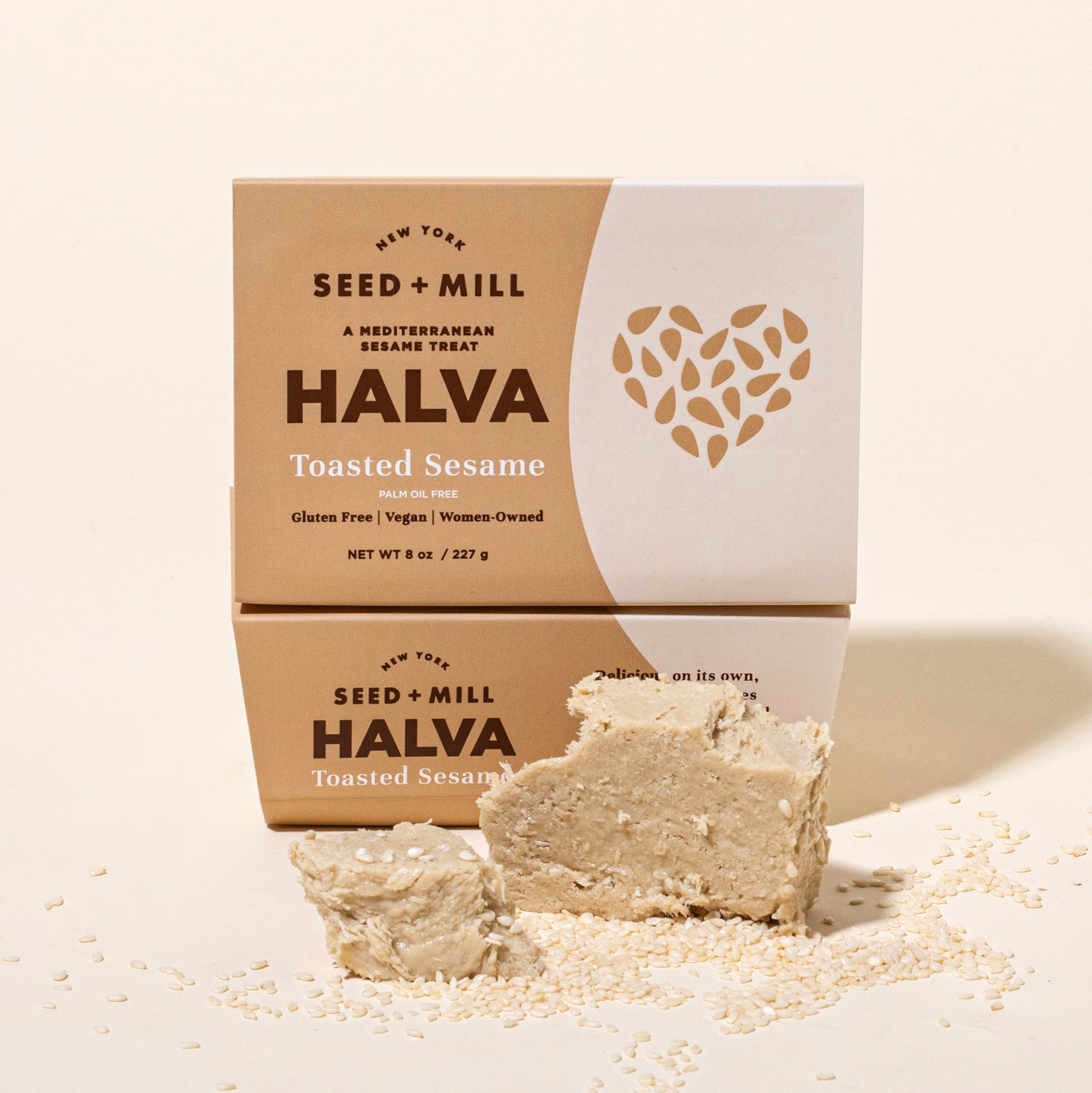 Seed + Mill Toasted Sesame Halva package with a piece of halva on a beige background