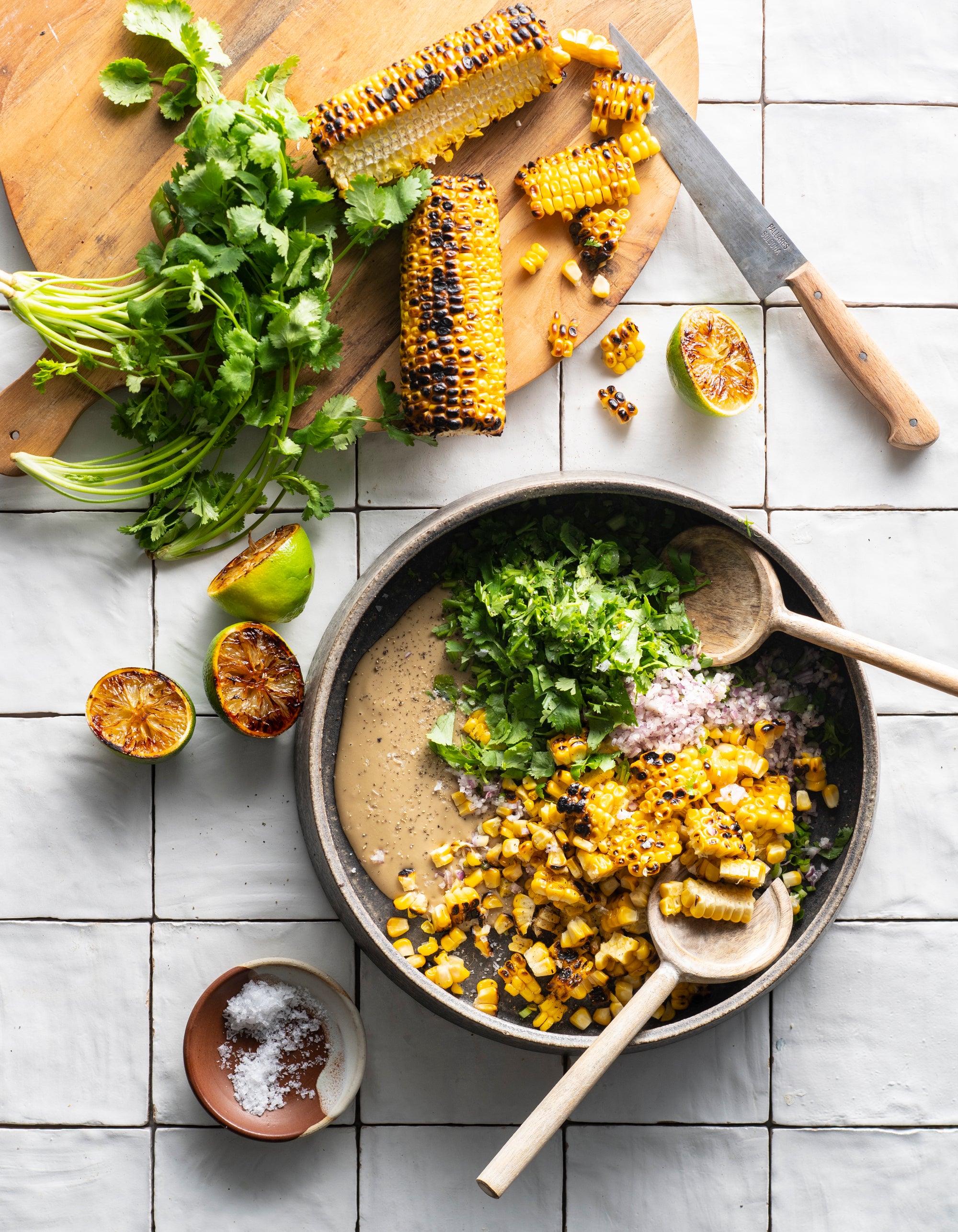 Picture of Tahini Elote with corn, cilantro, limes, and tahini 