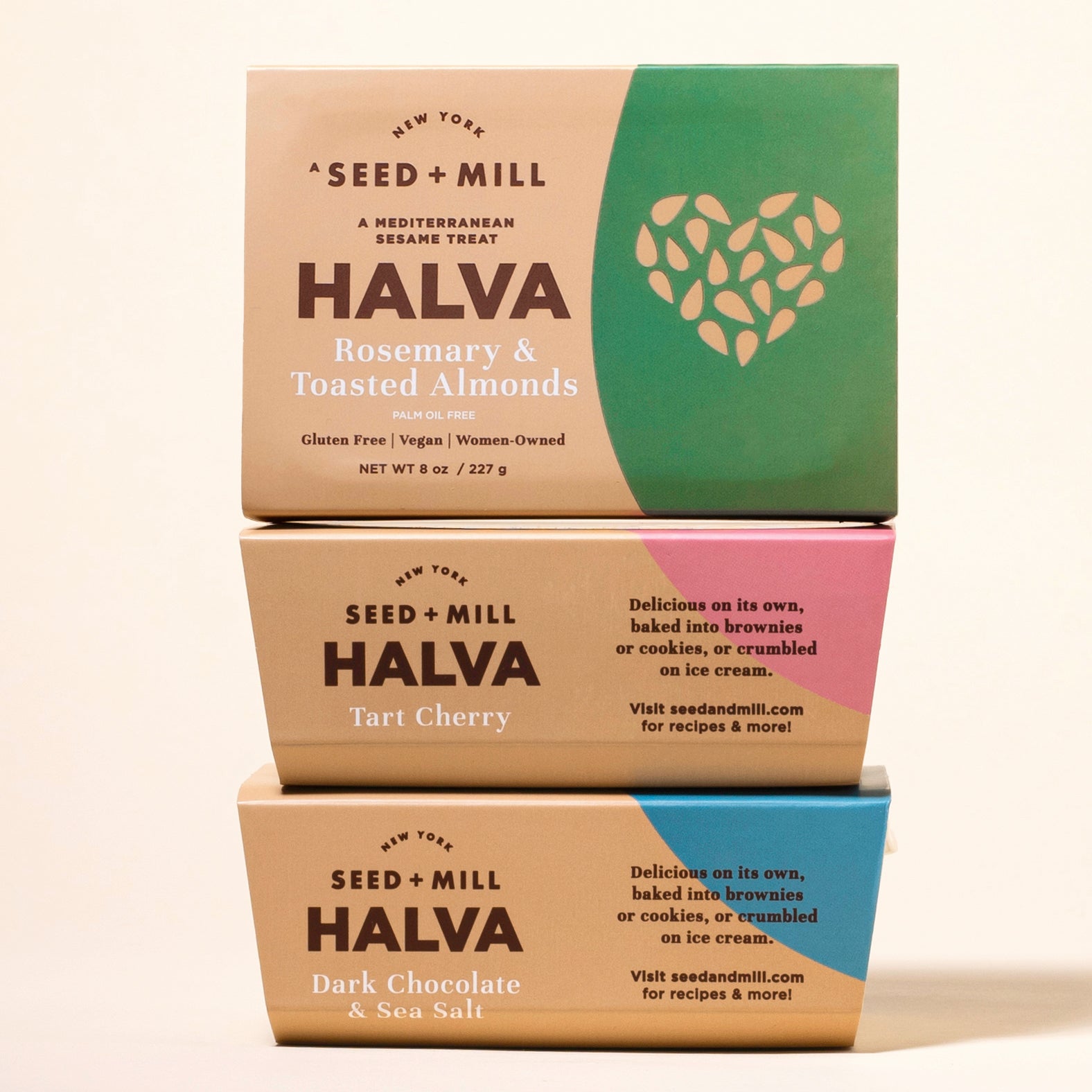 Three boxes of Seed + Mill Halva in different flavors on a beige background