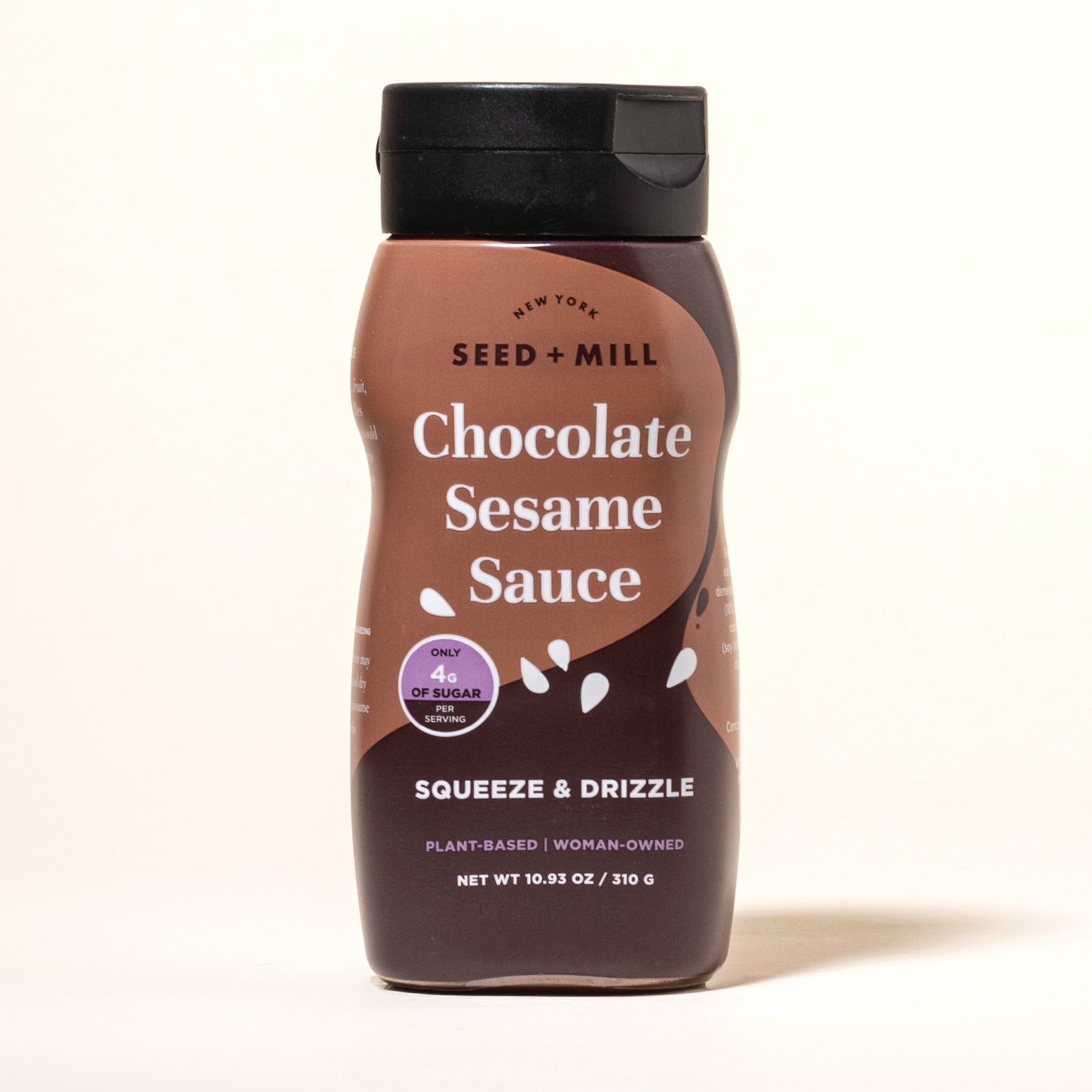 Bottle of Seed + Mill Chocolate Sesame Sauce on a white background
