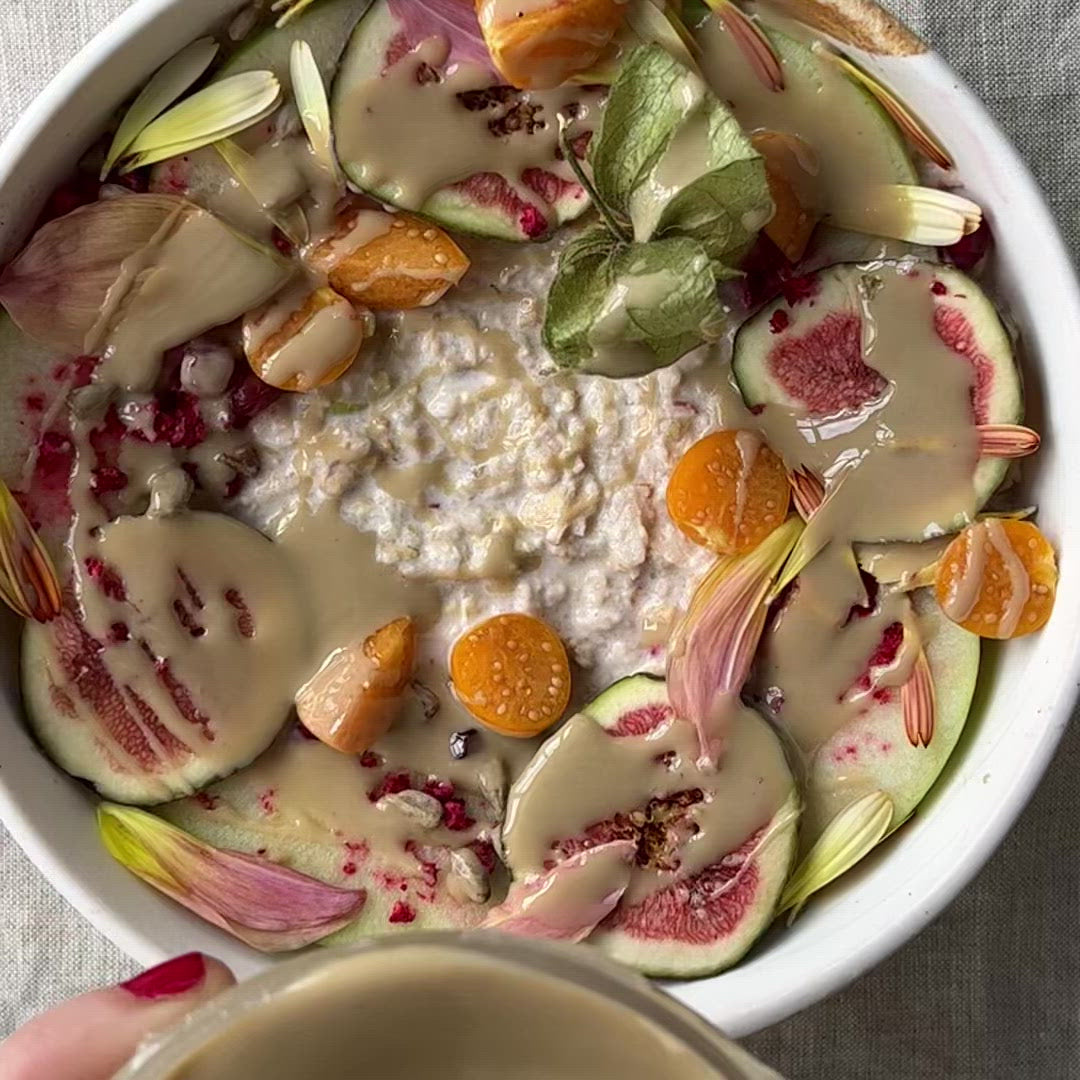 Video of tahini being drizzled onto a bowl of fruit and yogurt